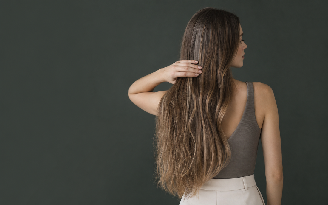 Young Caucasian woman restoring softness to dry frizzy Remy human hair extensions
